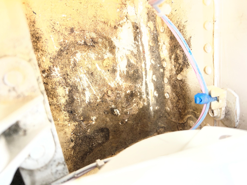 Debris and contamination hiding corrosion during a scheduled inspection