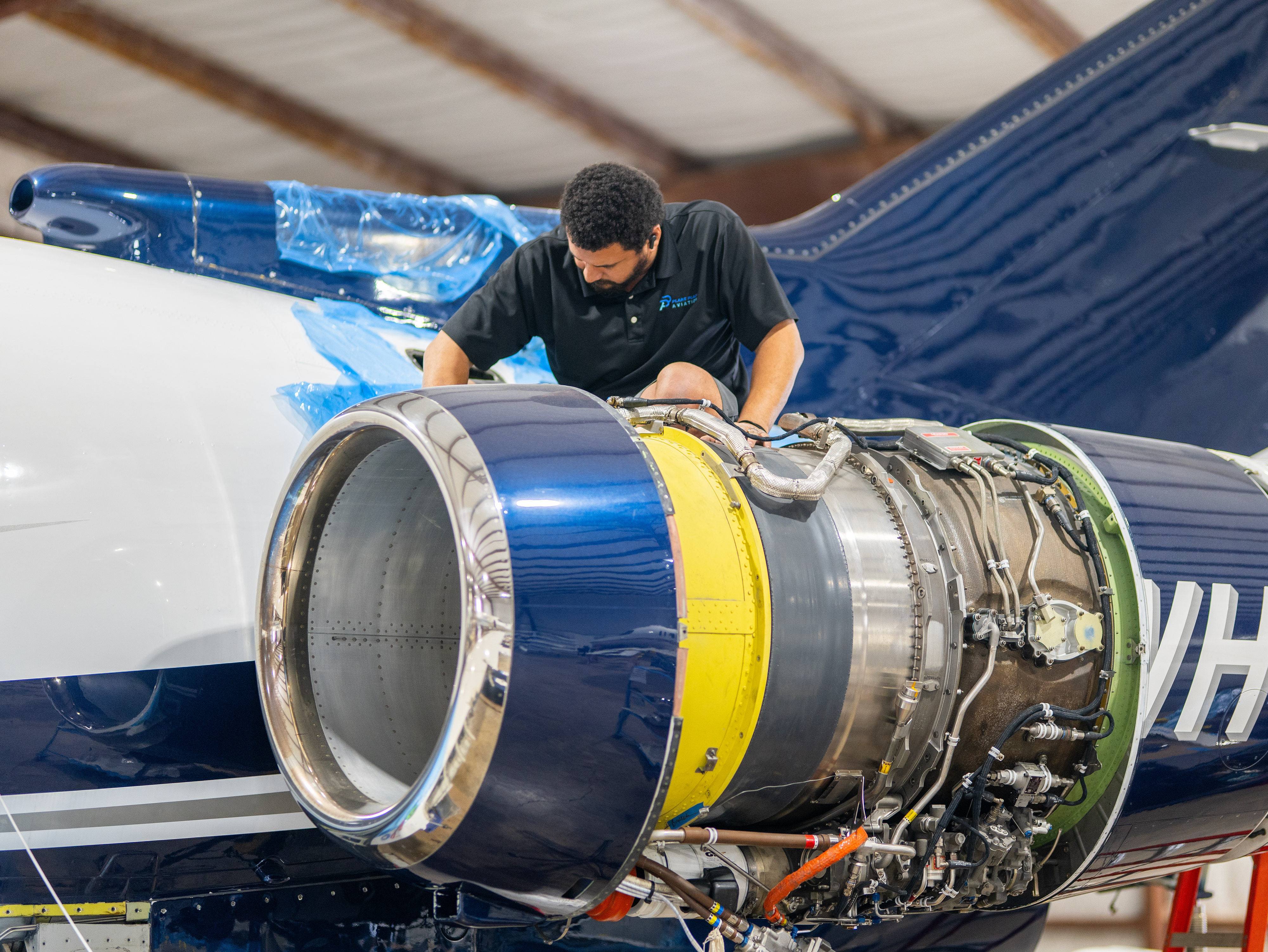 PPA technician performing engine maintenance on a Hawker business jet