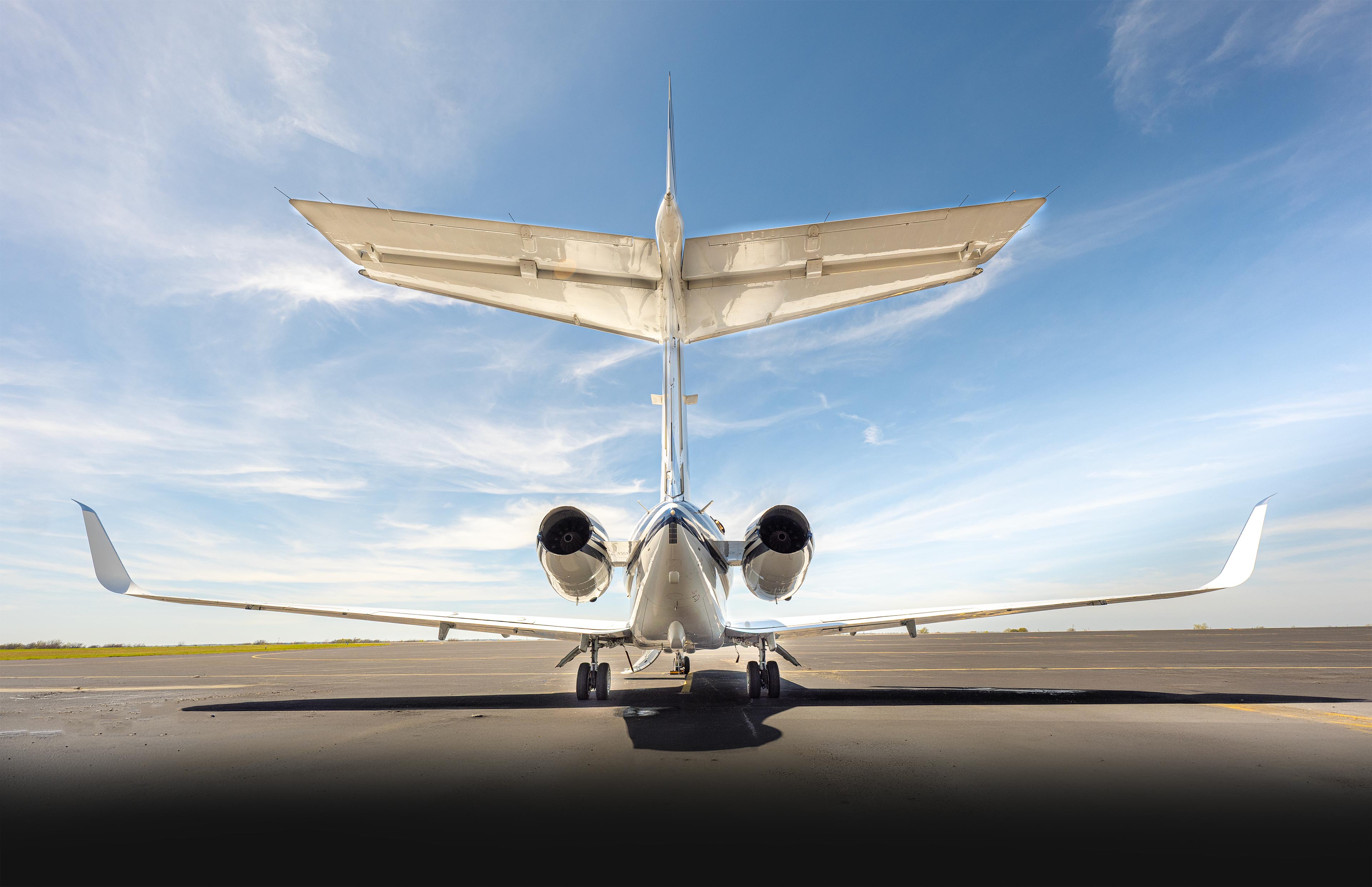 Business jet tail section at Plane Place Aviation hangar
