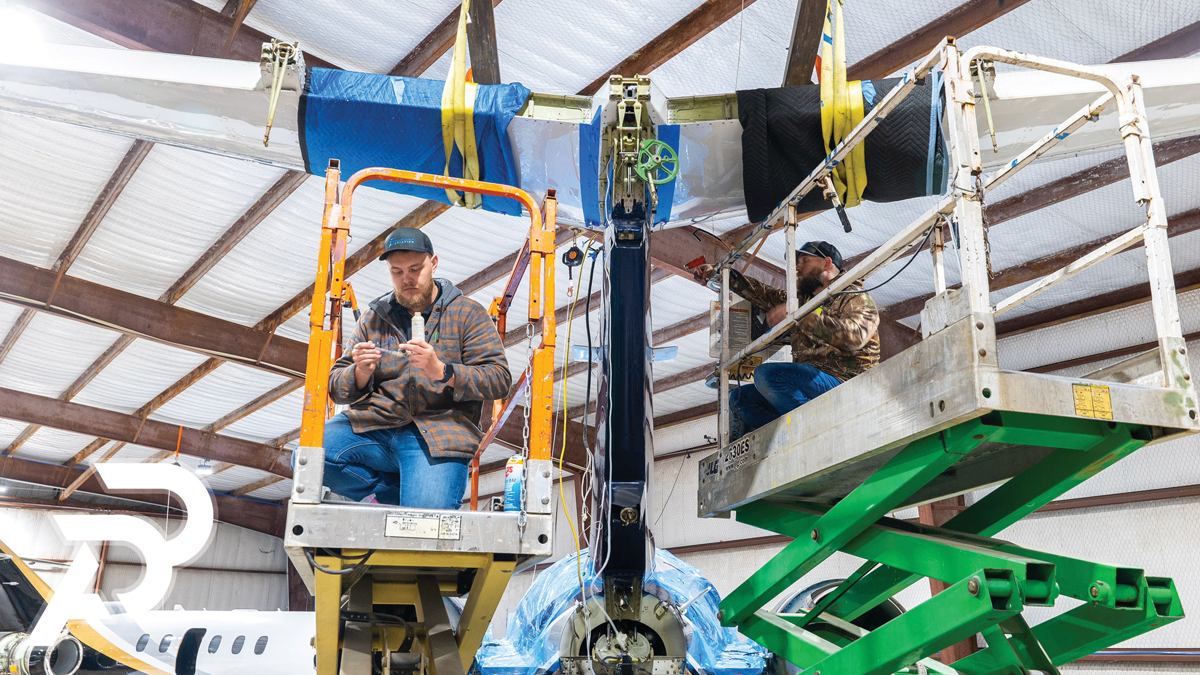 Plane Place Aviation technicians on the hangar floor in Cleburne