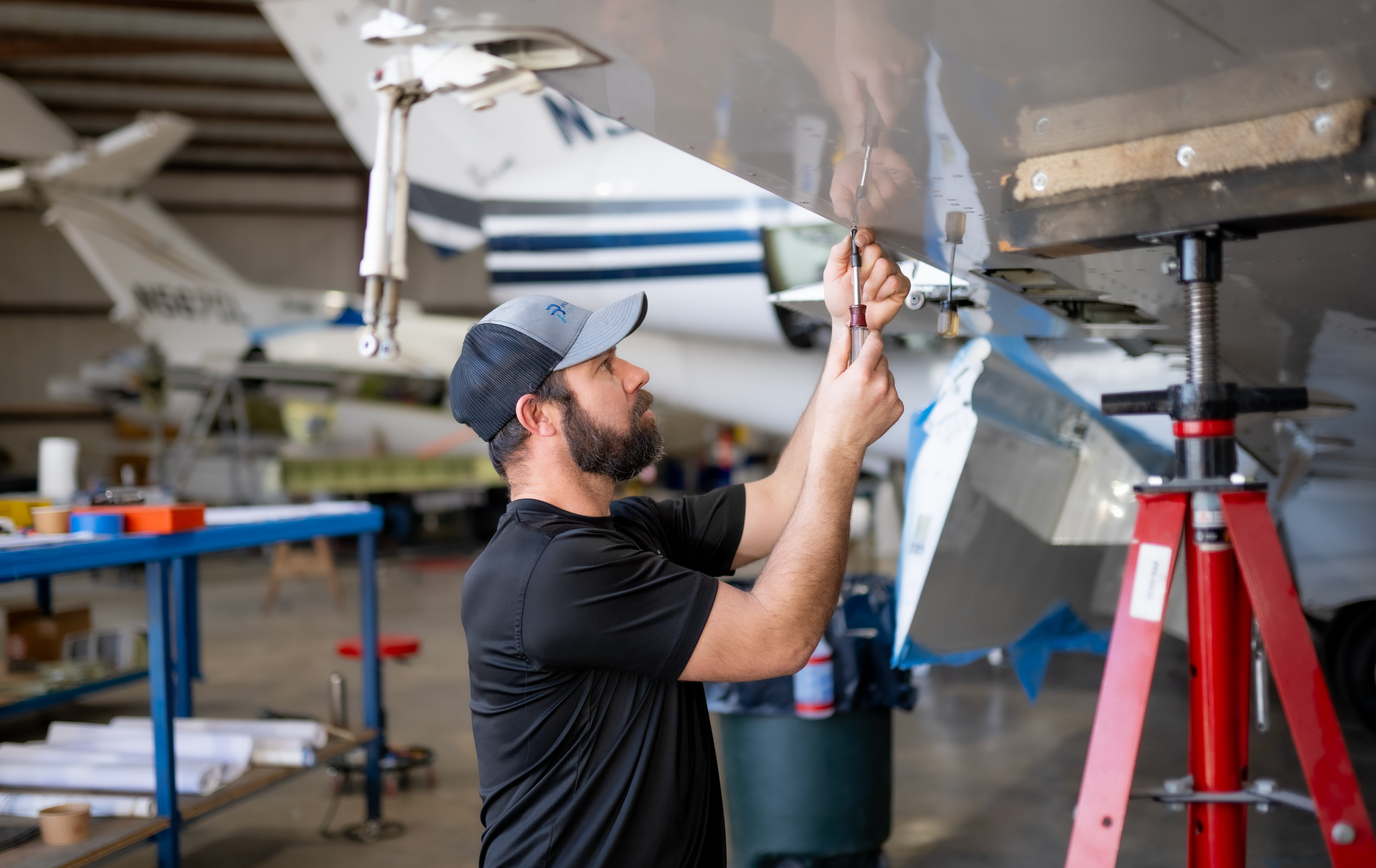 PPA tech working on winglet installation with hangar view