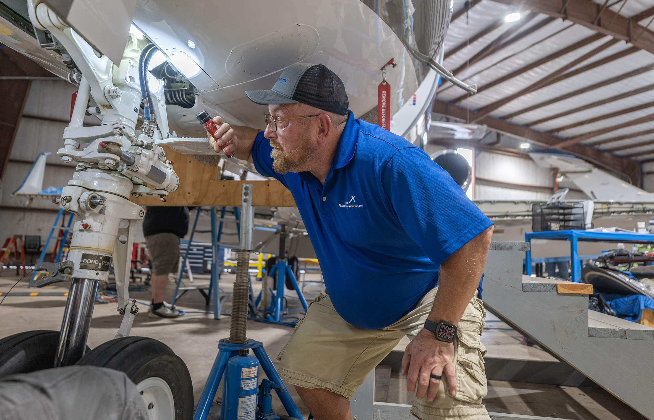 Plane Place Aviation technician performing pre-purchase inspections on business jet