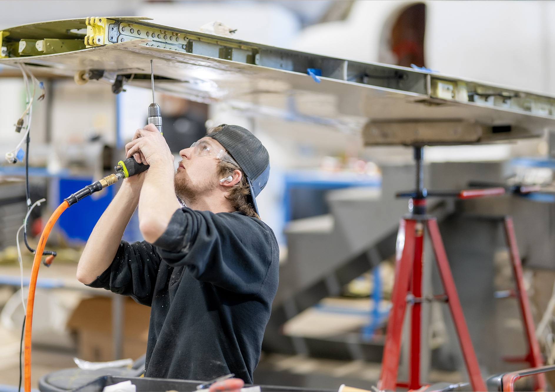 Plane Place Aviation technician performing structural repairs / modifications on business jet