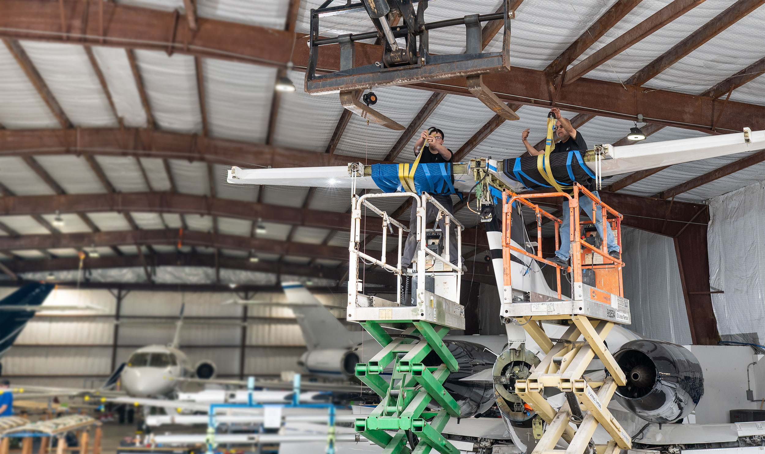 Technician performing Hawker tail section maintenance